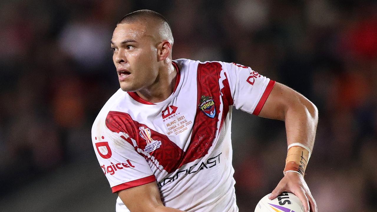 ST HELENS, ENGLAND - OCTOBER 18: Tui Lolohea of Tonga runs with the ball during Rugby League World Cup 2021 Pool D match between Tonga and Papua New Guinea at Totally Wicked Stadium on October 18, 2022 in St Helens, England. (Photo by Charlotte Tattersall/Getty Images for RLWC)