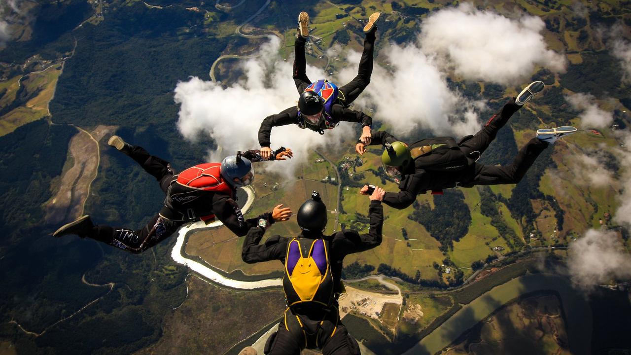 Mr Hateley, far right, during a group skydive. Photo: Facebook.