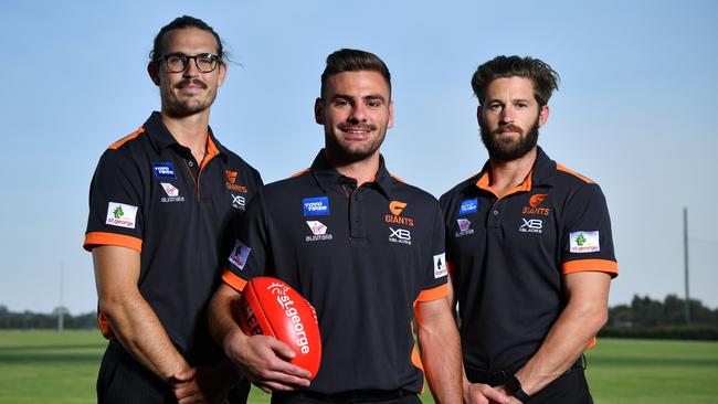 New captain Stephen Coniglio, centre, poses for a photo with outgoing captains Phil Davis, left, and Callan Ward, right, in December. Picture: Joel Carrett/AAP