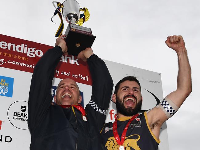 Doncaster East coach Steve Buckle and captain Nick Batsanis celebrate after winning the 2018 EFL Div 2 grand final. Picture: James Ross