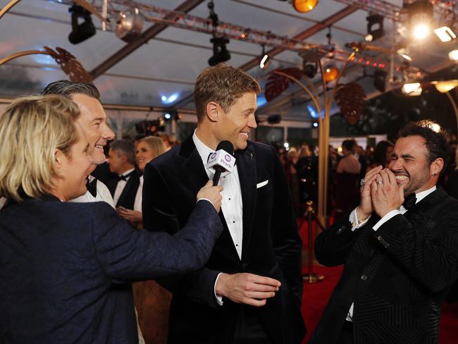 Celebrity vet Dr Chris Brown and TV chef Miguel Maestre had a laugh on the red carpet. Picture: AAP