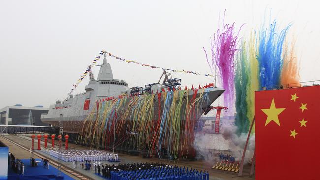 Fireworks explore next to China's new domestically-built 10,000-tonne Type 055 destroyer during a launching ceremony at Jiangnan Shipyard in Shanghai, China. (Wang Donghai/Xinhua via AP)