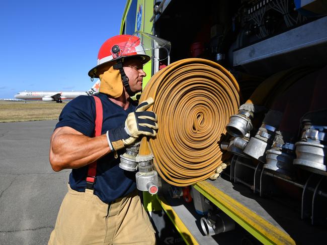 Aviation firefighter Justin Wessels at work at Sydney Airport. Pic: AAP Image/Joel Carrett