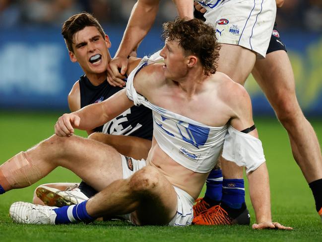 MELBOURNE, AUSTRALIA - APRIL 30: Nick Larkey of the Kangaroos and Lewis Young of the Blues clash during the 2022 AFL Round 07 match between the Carlton Blues and the North Melbourne Kangaroos at Marvel Stadium on April 30, 2022 in Melbourne, Australia. (Photo by Michael Willson/AFL Photos via Getty Images)