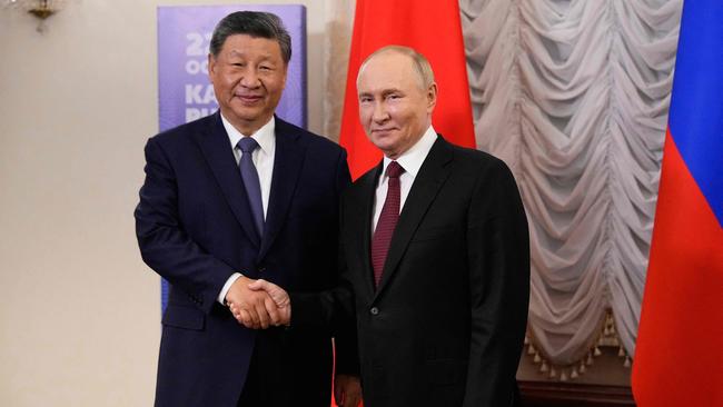 Russia's President Vladimir Putin meets with Chinese President Xi Jinping on the sidelines of the BRICS summit in Kazan. Picture: AFP.