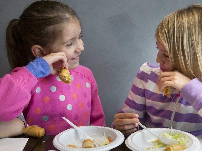 Canterbury Bankstown Express - Pictured LTR:  Alexia (5) and Emily (6) enjoy eating their food creations - Green Mango Vietnamese restaurant in Regents Park NSW held a children's cooking demo day today.  50 children from Noah's Little Ark Vacation Care centre visited to learn how to make crepes.  Shop 3/2 Amy Street, Regents Park NSW Australia - CUTE FRONT OF BOOK PHOTOS OF KIDDIES MUCKING ABOUT WITH INGREDIANTS