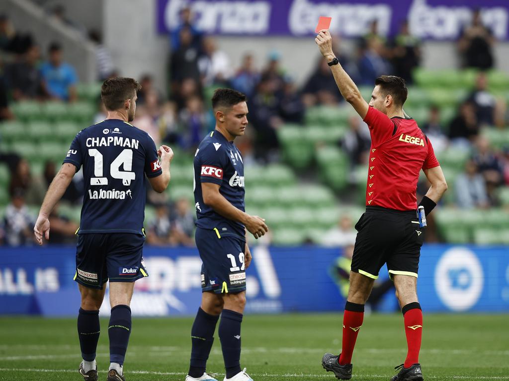 Fernando Romero (centre) is shown a red card by referee Jonathan Barreiro. Picture: Daniel Pockett/Getty Images