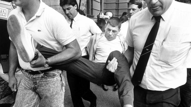 Victor Peirce being taken into court in 1988.