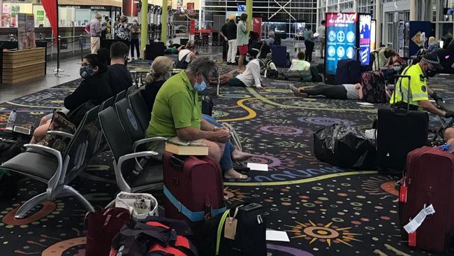 Passengers wait on the floor of the Alice Springs Airport at 2am on Wednesday after a charter flight to Darwin was grounded. Picture: Facebook