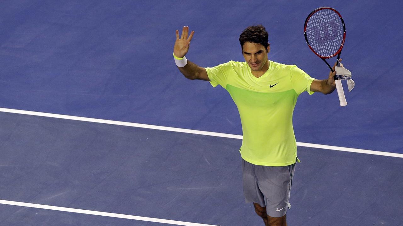 Roger Federer of Switzerland celebrates after beating Lu Yen-Hsun of Taiwan during their first round match at the Australian Open tennis championship in Melbourne, Australia, Monday, Jan. 19, 2015. (AP Photo/Lee Jin-man)