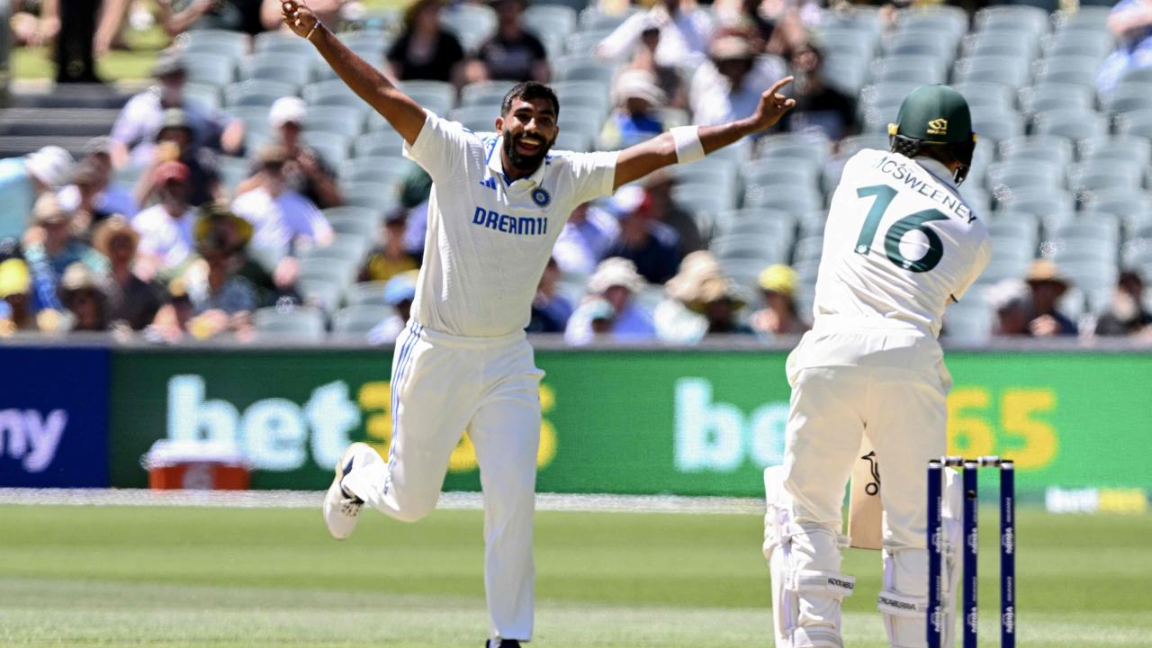 Jasprit Bumrah (L) celebrates dismissing Nathan McSweeney in Adelaide. (Photo by William WEST / AFP) /