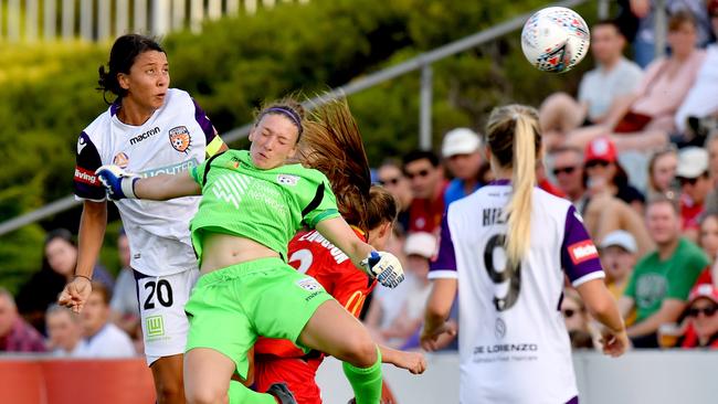 Perth Glory star Sam Kerr heads home against Adelaide United on Thursday night. Picture: AAP