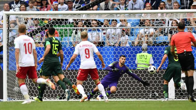 Mat Ryan is called into action as the Danes threaten.