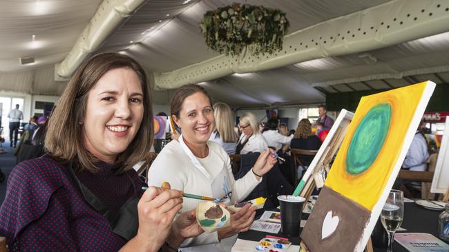 Caroline Vermaak (left) and Stacey Nieuwoudt participating in the World's Largest Paint and Sip Luncheon for Momentum Mental Health at Clifford Park racecourse, Friday, June 21, 2024. Picture: Kevin Farmer