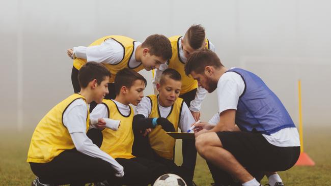 Children playing soccer.