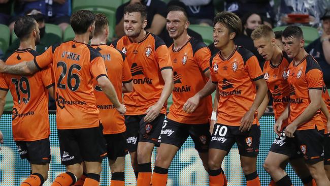 The Roar celebrate a Macaulay Gillesphey (fourth from left) goal during the A-League match between the Melbourne Victory and Brisbane Roar at AAMI Park in Melbourne on Saturday. Picture: Daniel Pockett/Getty Images