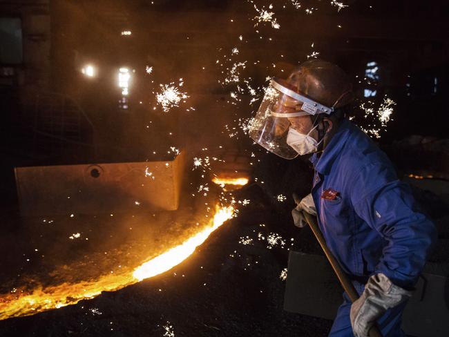 CHANGZHOU, CHINA - MAY 12:  A worker supervises molten iron at a furnace in the production area of the Zhong Tian (Zenith) Steel Group Corporation  on May 12, 2016 in Changzhou, Jiangsu. Zhong Tian (Zenith) Steel Group Corporation is a privately-owned manufacturer that employs over 13,000 workers at its facility in China's eastern Jiangsu province. Since 2001,the company says it has adopted new technology to streamline the production of premium quality steel and to reduce environmental impact. The majority of its steel output is for the Chinese market with 20% earmarked for export, mostly to Asia. The company says it is profitable, but admits business has dropped marginally from past years. China is the world's largest steel producer, accounting for over 50% of global supply. China's government has vowed to cut production capacity at state-owned enterprises by up to 150 million tonnes over five years to ease concerns of an oversupply on global markets. However, its efforts appear to be overshadowed by a recent increase in steel prices that has revived production at some Chinese facilities that had been closed down.  (Photo by Kevin Frayer/Getty Images)