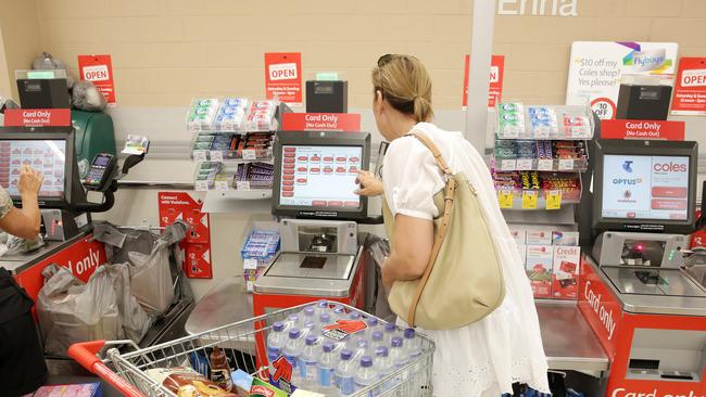 A customer uses the self-serve checkout at Coles (Picture/Mark Scott)