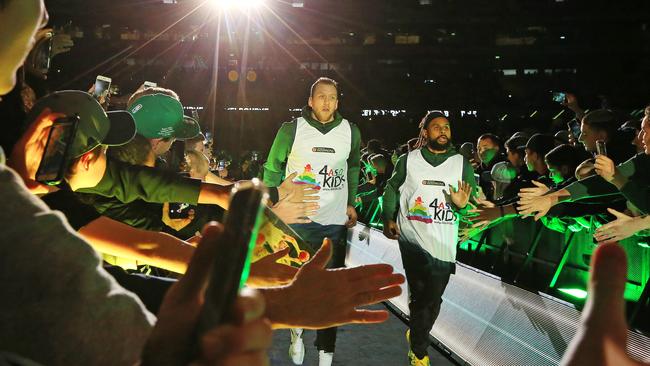 Fans reach out to greet the Boomers players. Picture: Mark Stewart