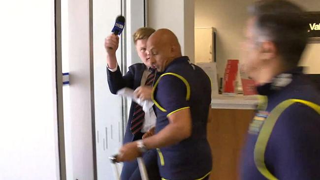 Channel 9 reporter Will Crouch was shoulder barged by a South African staffer.