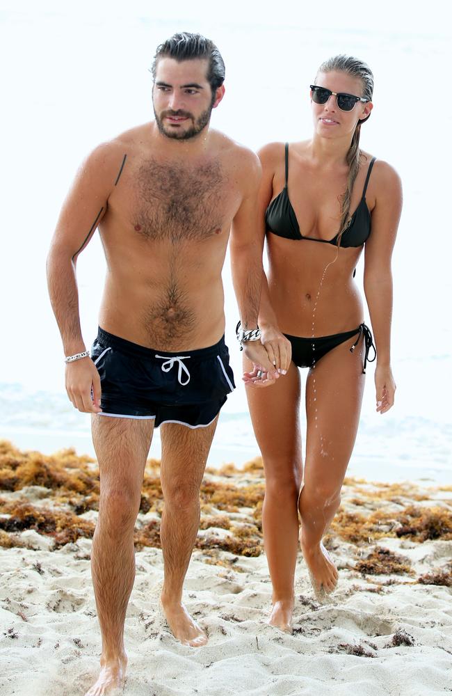 Hot blogger ... French Big Brother TV personality Martin Medus and Australian A Bikini A Day founder Natasha Oakley in Florida.