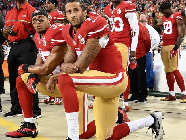 SANTA CLARA, CA - SEPTEMBER 12: Colin Kaepernick #7 and Eric Reid #35 of the San Francisco 49ers kneel in protest during the national anthem prior to playing the Los Angeles Rams in their NFL game at Levi's Stadium on September 12, 2016 in Santa Clara, California. Thearon W. Henderson/Getty Images/AFP / AFP PHOTO / GETTY IMAGES NORTH AMERICA / Thearon W. Henderson