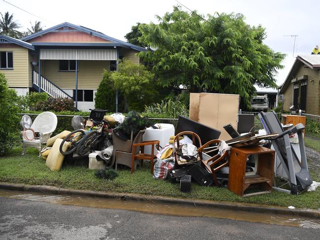 Flood damaged furniture and belongings dumped on the footpath outside a home on February 08, 2019 in Townsville. Picture: Getty