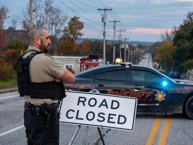 Police set up road blocks in Maine after a shooter who killed 18 people remained at large. Picture: AFP