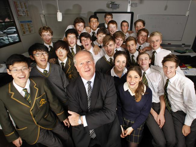 Former Trinity Grammar deputy headmaster Rohan Brown with students.