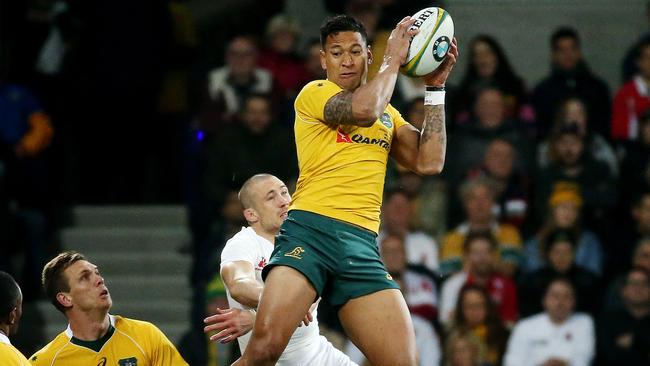 Israel Folau flies high over Mike Brow. Picture: Colleen Petch.