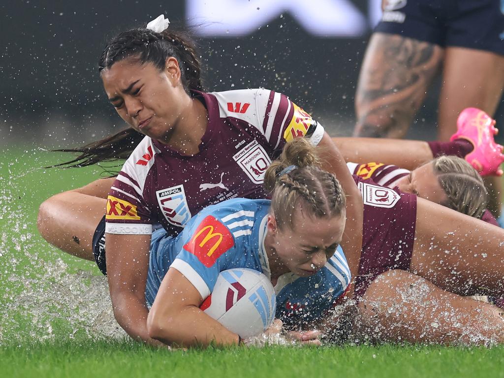 SYDNEY, AUSTRALIA - MAY 15: Abbi Church of the Blues is tackled during game two of the Women's State of Origin series between the New South Wales Blues and Queensland Maroons at Allianz Stadium on May 15, 2025 in Sydney, Australia. (Photo by Cameron Spencer/Getty Images) *** BESTPIX ***