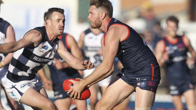 Norwood's Brad McKenzie looks to kick clear from the backline. Picture: AAP/Dean Martin.