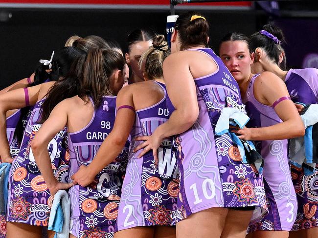 Firebirds players embrace during the win against the Fever. Picture: Getty Images