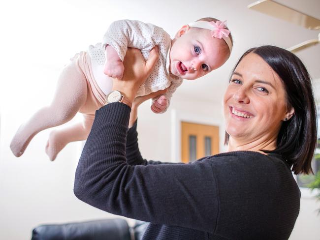 Georgie Frawley, who has endured epileptic seizures her whole life, with her five-month-old daughter Charlotte. Picture: Mark Stewart