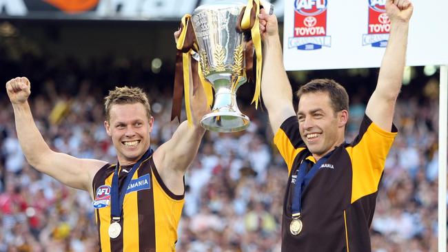 Mitchell as Hawthorn captain with coach Alastair Clarkson after the 2008 premiership win.