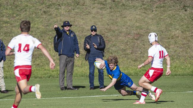 Myles Rosemond breaks away to try for Toowoomba Grammar School. Picture: Kevin Farmer