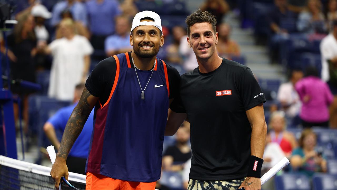 The boys are used to playing on the same side of the net. Photo by Elsa/Getty Images