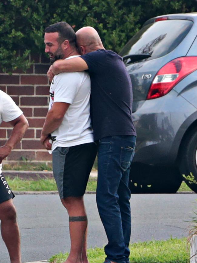 Daniel Abdallah is comforted at the scene. Picture: Adam Yip