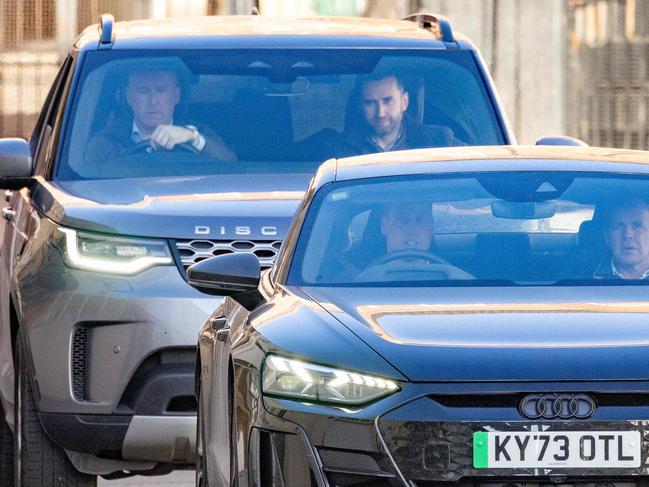 Britain's Prince William, Prince of Wales (L) drives himself away from the London Clinic in London on January 18, 2024 where his wife Britain's Catherine, Princess of Wales, underwent surgery. Britain's Catherine, Princess of Wales, is facing up to two weeks in hospital after undergoing successful abdominal surgery, Kensington Palace announced on January 17. (Photo by HENRY NICHOLLS / AFP)