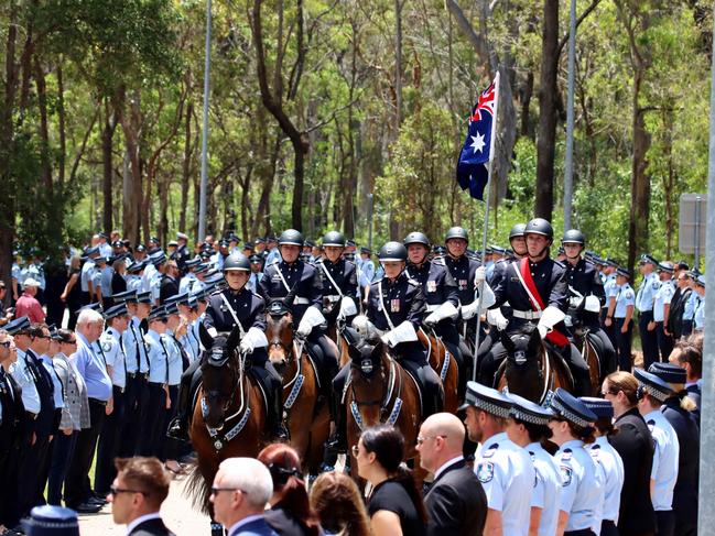 The funeral procession at the memorial service with full police honours for constables Rachel McCrow and Matthew Arnold at Brisbane Entertainment Centre. Picture: David Clark