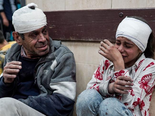 Palestinians injured during Israeli bombardment on the Nuseirat refugee camp in central Gaza await medical treatment. Picture: AFP