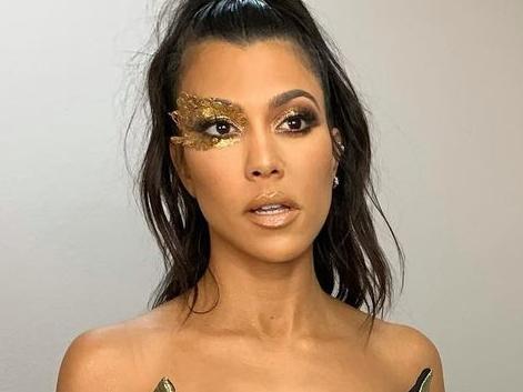 Kourtney Kardashian in a plunging gown.