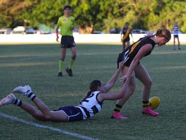 Pictured (l-r): Croc Mia Schreiber and Tiger Lauren Davon. Crocs v Tigers at Port Douglas Sporting Complex. AFLW Cairns 2024. Photo: Gyan-Reece Rocha