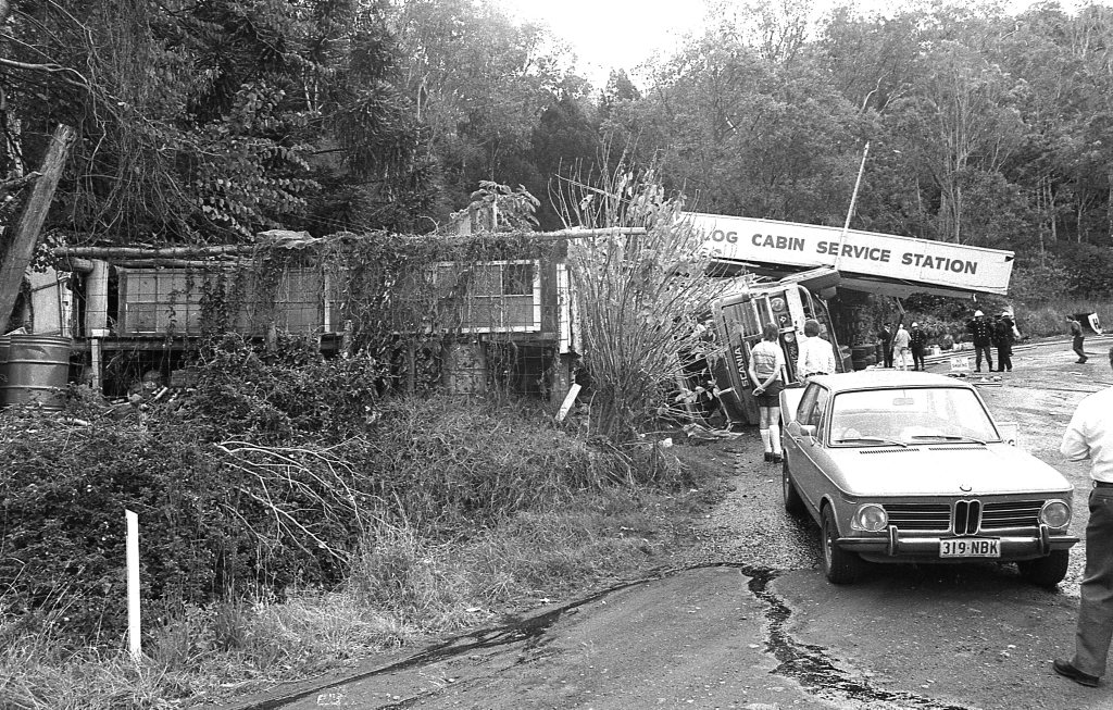 Historic: Toowooba: Accidents Semi-trailer crash at the Log Cabin Service Station on the Toowoomba Range in on 6th September,1978. Three men suffered minor injuries during the crash when the semi-trailer rolled taking out petrol bowsers. A car parked at the service station was also damaged. Photo: Bruce Mackenzie / The Chronicle Neg U869. Picture: Bruce Mackenzie