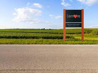 One of the new Lismore gateway signs being put up by Lismore City Council.