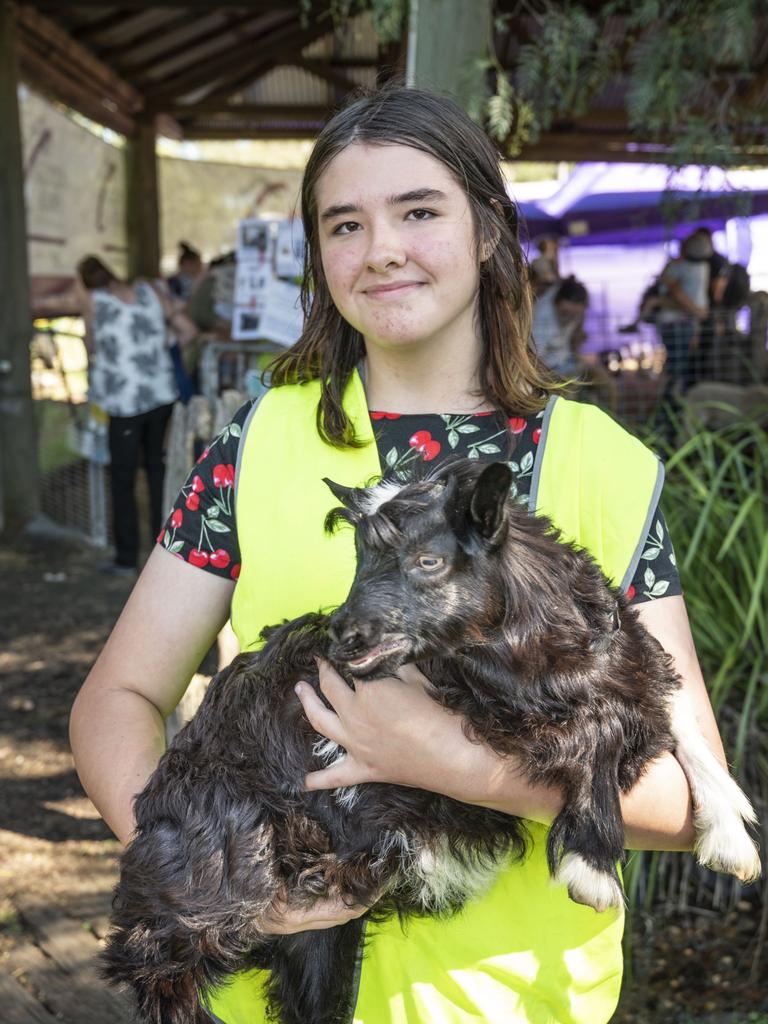 Sage Manning from Viv's Farm Animals holds Victor the goat at the Toowoomba Royal Show. Friday, March 25, 2022. Picture: Nev Madsen.