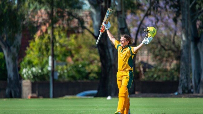 Darcy McRostie celebrates after his matchwinning 102 runs for Pembroke in its win against Adelaide High School in the Messenger Bowl T20 final. Picture: Peter McRostie