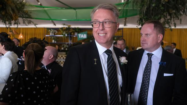 Tabcorp chair Bruce Akhurst, left, at Flemington in 2022. The ASA says he is paid too much. Picture: Luis Enrique Ascui