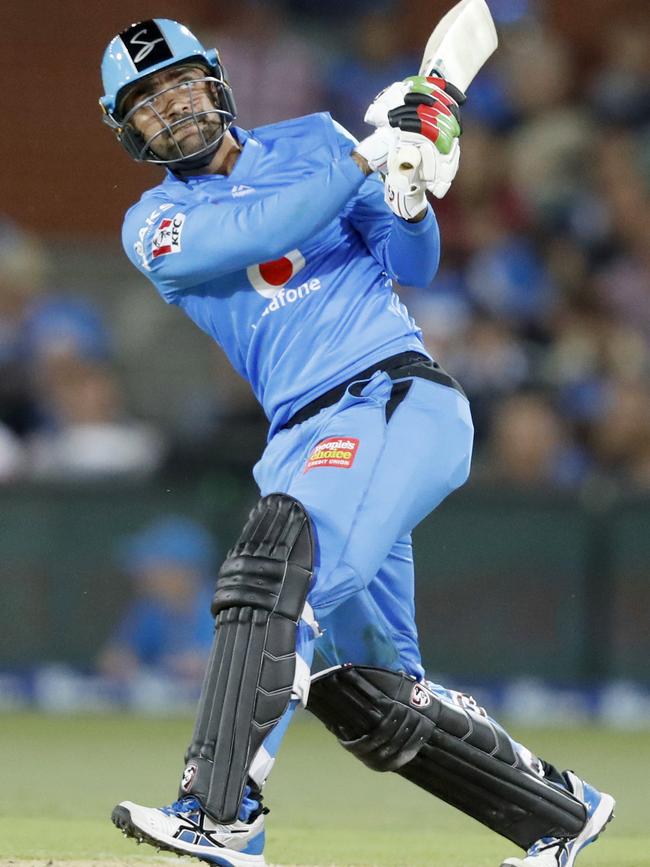 Rashid Khan thumps a six against the Sydney Thunder. Picture: Kelly Barnes/AAP