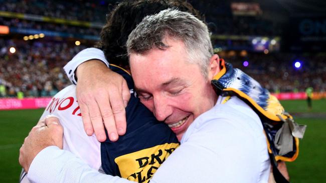 SYDNEY, AUSTRALIA - OCTOBER 04: Johnathan Thurston of the Cowboys celebrates with Cowboys coach Paul Green after winning the 2015 NRL Grand Final match between the Brisbane Broncos and the North Queensland Cowboys at ANZ Stadium on October 4, 2015 in Sydney, Australia. (Photo by Cameron Spencer/Getty Images)